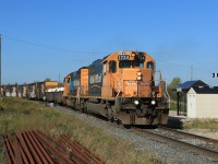 1734 and sister 1735 bring their train around the bend at Porquis Jct with 52 cars picked up from Kidd Mine.  