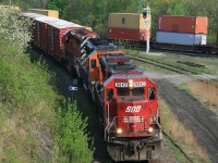 CP train 426 slides down the cowpath into Hamilton Jct...BNSF 8051 second unit is repaying some horsepower hours.....CN 382 is in the background