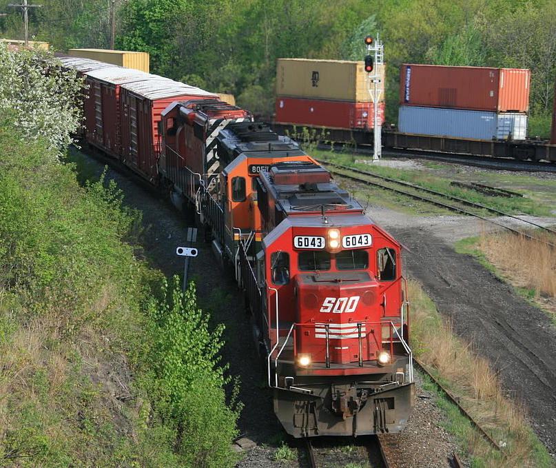CP train 426 slides down the cowpath into Hamilton Jct...BNSF 8051 second unit is repaying some horsepower hours.....CN 382 is in the background