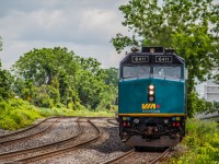 6411 leading VIA 65, slithers down the track on approach to Dorval station.