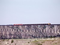 Three GP-9s and an A-B set of F units lead some hoppers towards Calgary.

