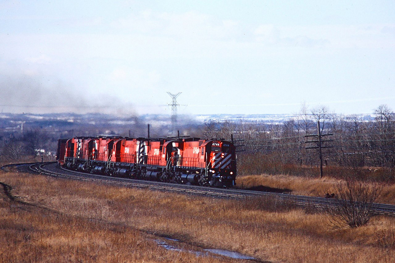 CP's one and only M640 4744 leads five big alcos on an eastbound freight. One of those shots you kick yourself for. My Brother skipped classes to to spend an afternoon at Port Hope. I stayed in class and never saw the M640 until it was donated to Exporail.