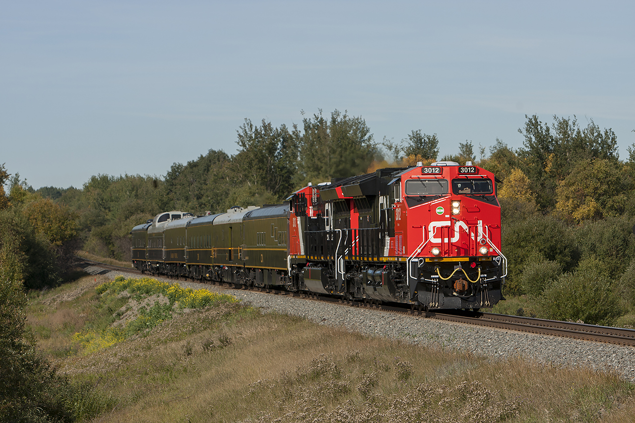 CN Train P617, with the Chairman of the Board and other executives on board rolls along the Edson Sub near Wildwood Alberta
