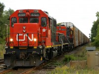 L50932 29 crawls up the grade to Hardy at about 5mph with CN 4728, CN 207, CN 7230 and 64 empty autoracks for OSR at Beachville. CN 7230 had died somewhere along the line leaving 4728 to do all the work