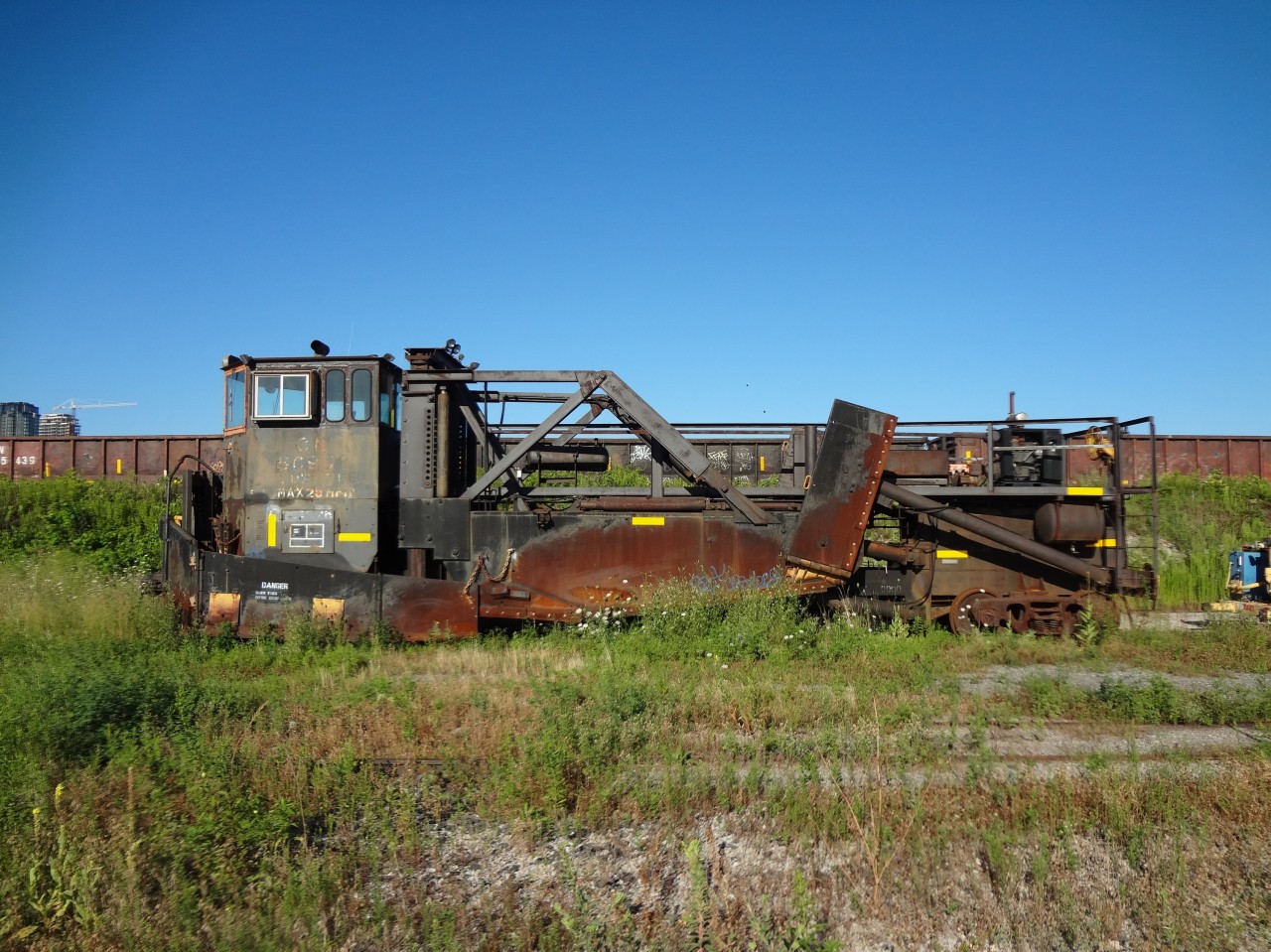 The exterior of CN 50948 is as dated and beat up as the cab interior shot I previously submitted. It has been quite some time since the wheels have rolled and the plow blades have touch the ballast for this spreader.