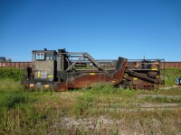 The exterior of CN 50948 is as dated and beat up as the cab interior shot I previously submitted. It has been quite some time since the wheels have rolled and the plow blades have touch the ballast for this spreader.