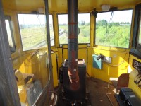 All the comforts of home can be found in the cab of CN 50948 Jordan Spreader. Comfortable seating, a warming oil fired heater with lunch warmer, radio, panoramic windows, overhead lighting, air circulation fan, and a plethora of spare parts, oil, and other necessities to keep it all running. Railroading is not always the glamorous environment viewed from the side of the tracks.