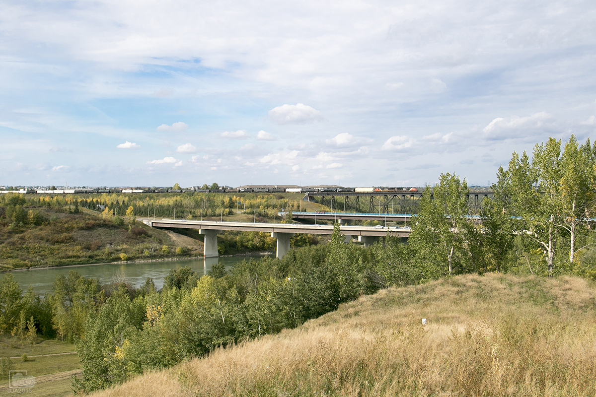 Testing rail across this trestle made it more desirable to shoot a train over it. CN 2242 east makes its way across the trestle over The North Saskatchewan River.