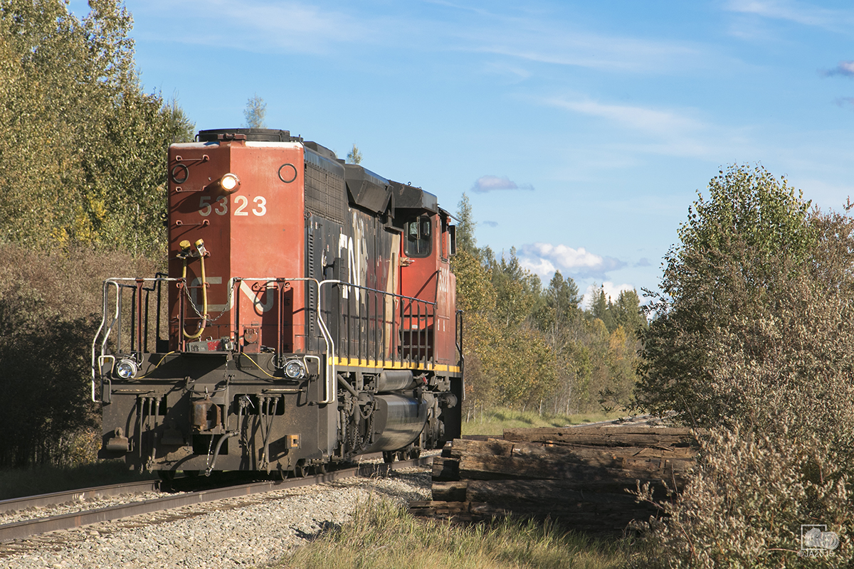 Running light power and long hood forward, CN 505 CN 5323 west is cleared through working limits.