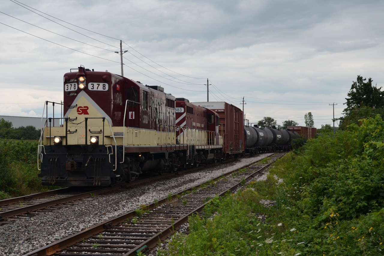 The St. Thomas Job has just finished servicing the CN yard and is heading back to Woodstock with a small cut of cars.