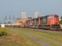 A GP9RM trails a pair of SD75I to presumably be dropped off at Mac yard on a hazy morning in downtown London.