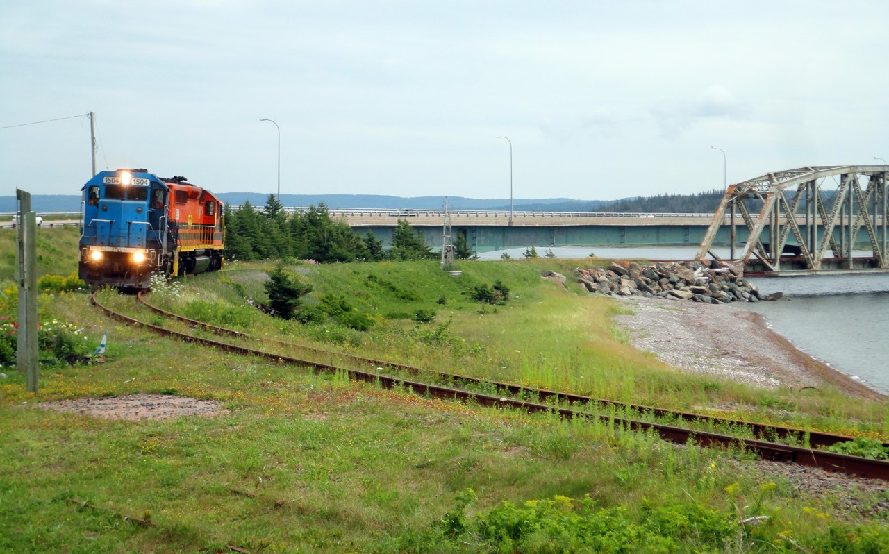 Last 'train' to travel on the Sydney Sub. With a track inspection run out date on the 16th the CBCNS decided to move their power out on the 14th. Due to falling traffic on the line the CBCNS decided the best and only option for them was to abandon the subdivison which runs from port Hawkesburry to Sydney. I cought up to the train at Iona, which is the location of the Grand Narrows bridge, a  516.33 m (1,694 ft) long bridge which is the longest in the province. The offical opening of the bridge 135 years ago was done by Lord Stanley, the donor of the Stanley Cup, who drove a steam engine across the bridge himself to declare it open.
