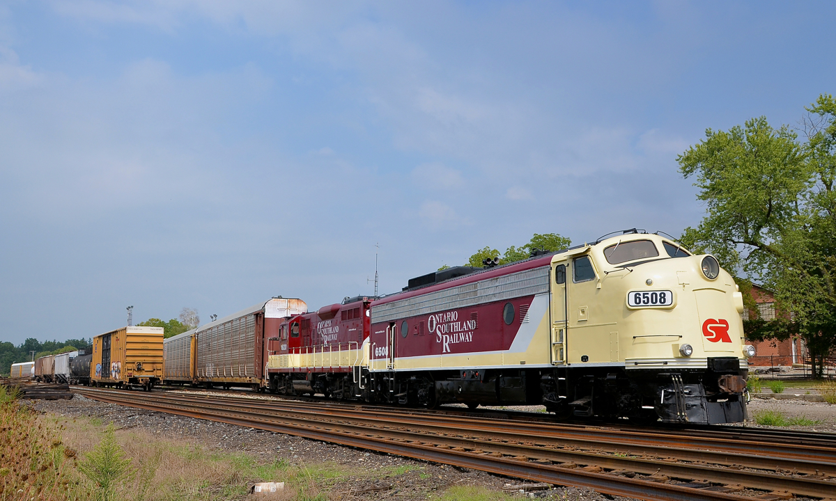 A classy unit on a classy railway. From freshly repainted FP9A OSRX 6508, to how open their crew and even their owner is to railfans, the Ontario Southland is one classy railway. Here during a brief period of sunshine, 6508 and GP9 1620 sit in front of the Woodstock station, awaiting the appearance of CP 244 with autoracks for the GM Cami plant in Ingersoll.