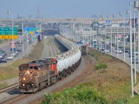 <b>Class lights lit.</b> I knew that CN X401 was running with a BCOL leader (a train worthy of interest already at this point), but I was not aware that it was a 100% TankTrain consist (normally CN 401 is mixed freight). Thankfully I had picked a location that shows the whole train, as you can see CN X401 with BCOL 4614 leading (with its class lights lit) and CN 2298 trailing as it snakes through a curve. At right VIA 50 is seen on the south track. 