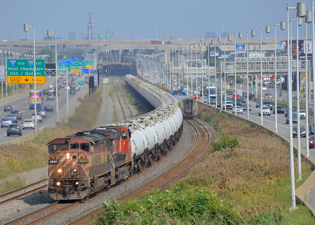 Class lights lit. I knew that CN X401 was running with a BCOL leader (a train worthy of interest already at this point), but I was not aware that it was a 100% TankTrain consist (normally CN 401 is mixed freight). Thankfully I had picked a location that shows the whole train, as you can see CN X401 with BCOL 4614 leading (with its class lights lit) and CN 2298 trailing as it snakes through a curve. At right VIA 50 is seen on the south track.