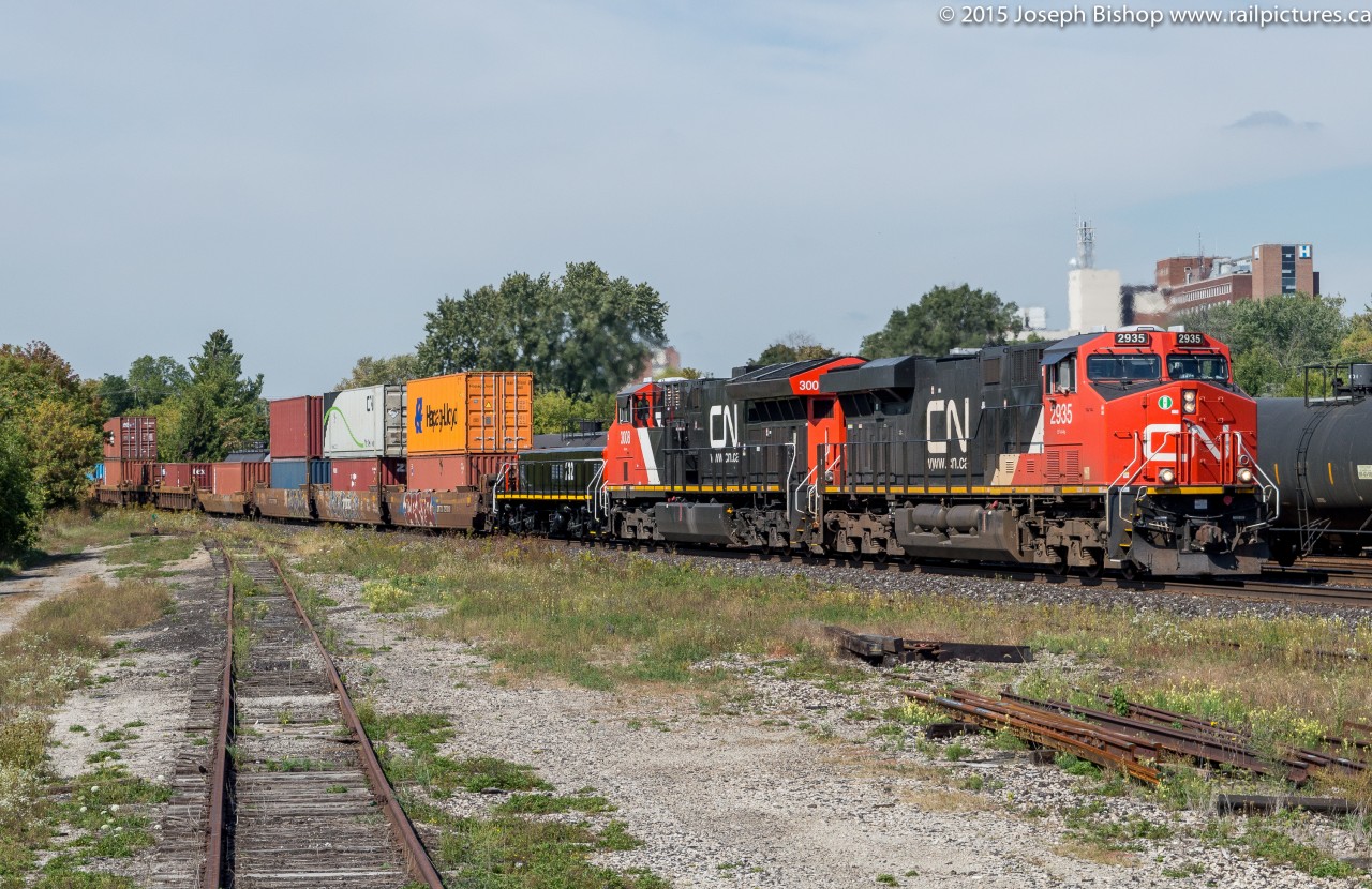 CN 148 cruises through Brantford with CN 2935, CN 3008 and CN 232 on a sunny first day of fall.  CN 232 is a slug unit most likely on its way to Brampton Intermodal Terminal, it appears to have been recently overhauled and is sporting a nice fresh coat of paint.