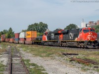 CN 148 cruises through Brantford with CN 2935, CN 3008 and CN 232 on a sunny first day of fall.  CN 232 is a slug unit most likely on its way to Brampton Intermodal Terminal, it appears to have been recently overhauled and is sporting a nice fresh coat of paint.