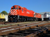 <b>Glistening in the afternoon sun.</b> M630 CP 4563 looks great in the afternoon sun, with fresh paint a large multimark at the rear. Behind it is C424 CP 4237. At left is the nose of M420W SLQ 3569 and GP9 AMT 1311 is at right.
