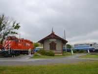 <b>GP9's on either side of Barrington Station.</b> GP9 AMT 1311 pushes the excursion train (with an all-AMT consist for the first time) past Barrington station as another GP9 (CP 1608) idles on the other side of the station during the first day of diesel weekend.