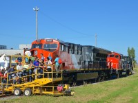 <b>CN family day at Taschereau Yard.</b>As part of CN family day in Montreal today, brand new ET44AC CN 3017 is open for display. Behind it is GP40-2(W) CN 9591 (with no hood and its prime mover fully exposed) and Jordan spreader 50951.
