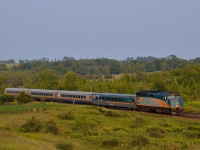 VIA 6434 leads a westbound through Newtonville towards sunset
