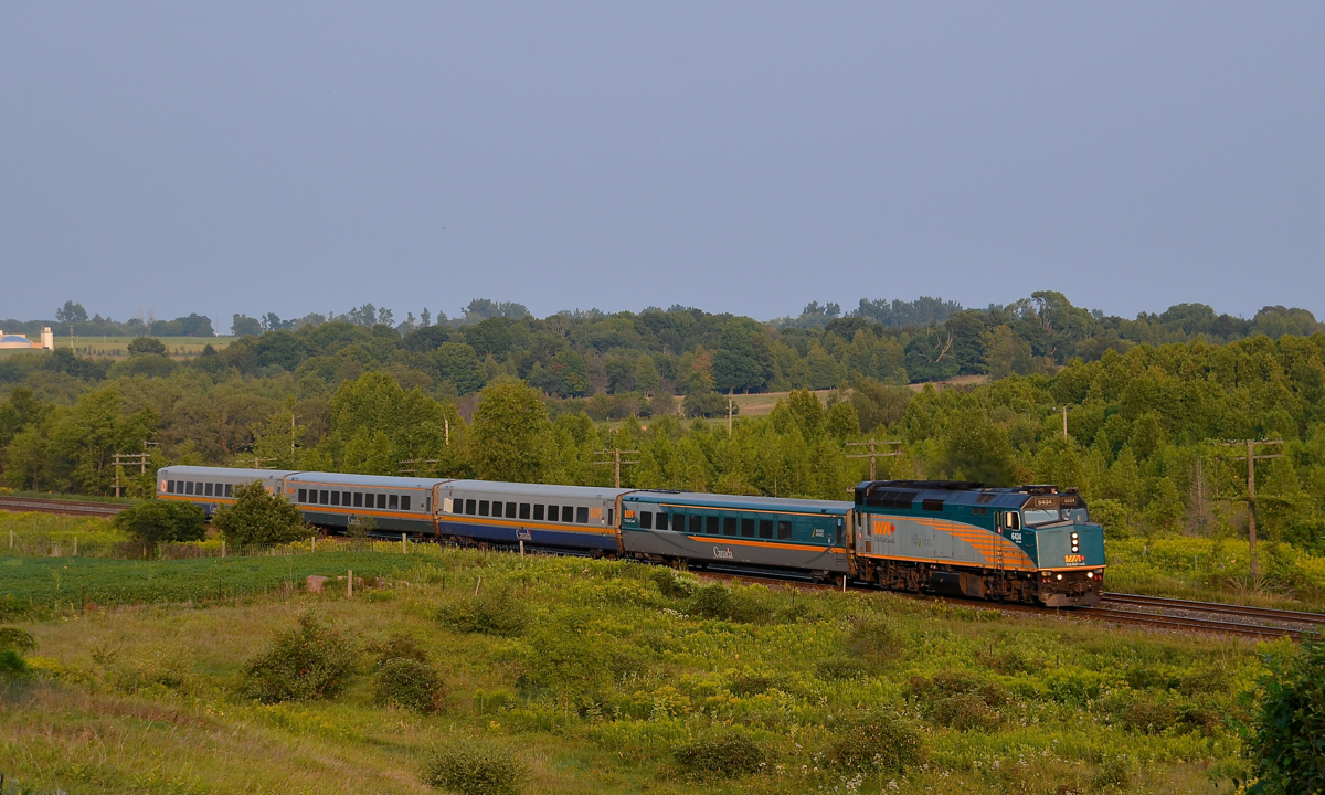 VIA 6434 leads a westbound through Newtonville towards sunset