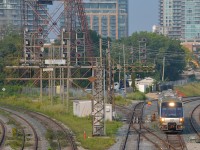 <b>Passing a lot of searchlight signals.</b> A Union Pearson Express train is coming back from Pearson Airport and is passing a lot of searchlight signals as it enters the Union Station Rail Corridor.