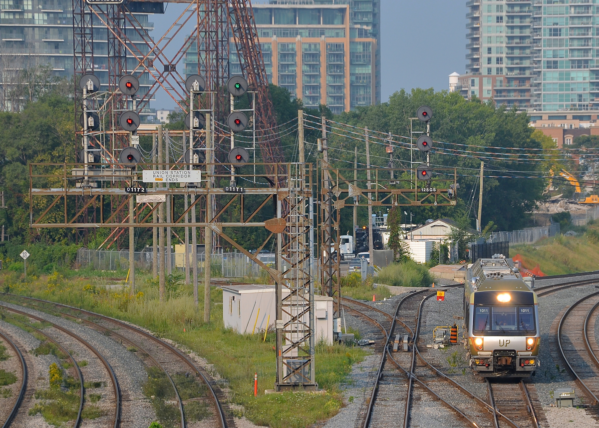 Passing a lot of searchlight signals. A Union Pearson Express train is coming back from Pearson Airport and is passing a lot of searchlight signals as it enters the Union Station Rail Corridor.