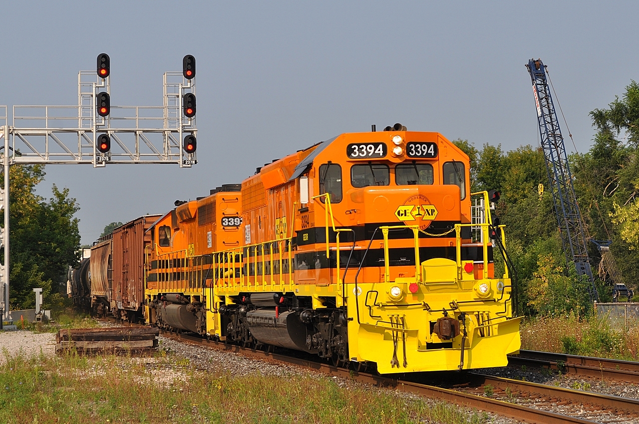 The crane at right is one of several involved in building a third track over Silver Creek and McNabb Street, part of the extensive improvements in the Georgetown area to allow all day GO service on the Kitchener line.