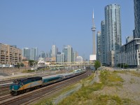 <b>Towards downtown Toronto.</b> VIA 6414 pushes a deadhead movement towards Toronto's Union Station during the afternoon rush hour. In the background is Toronto's ever changing downtown skyline.
