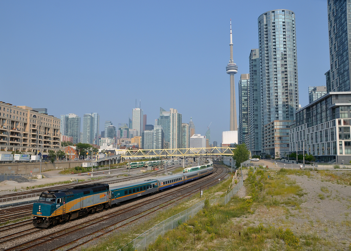 Towards downtown Toronto. VIA 6414 pushes a deadhead movement towards Toronto's Union Station during the afternoon rush hour. In the background is Toronto's ever changing downtown skyline.