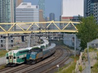 <b>Past a stopped GO Transit train.</b> VIA 6414 backs an LRC consist towards Union Station in Toronto, passing a stopped GO Transit train.