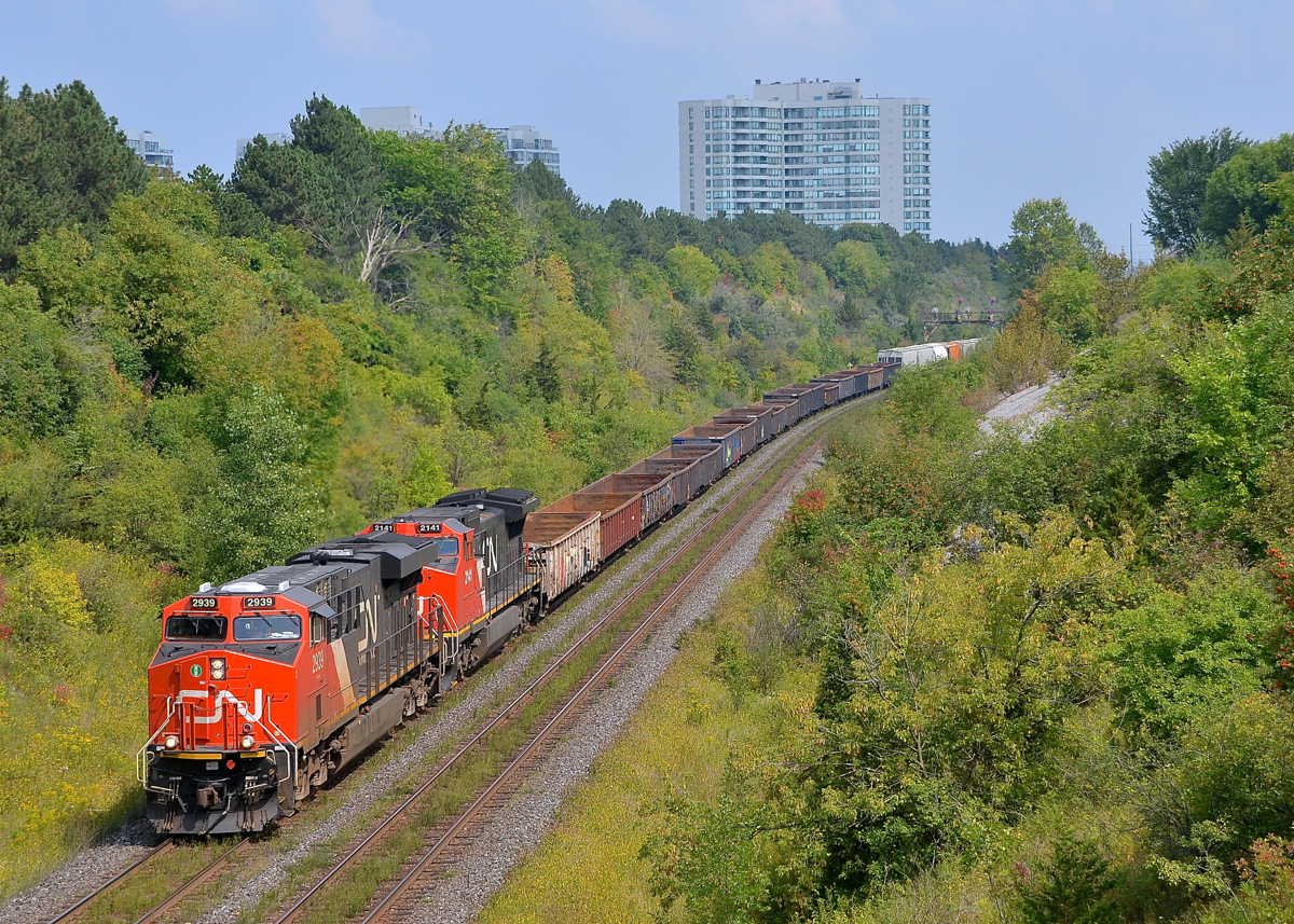 9 month old and 23 year old GE's. Nine month old ES44AC CN 2939 and and twenty-three year old Dash8-40CW CN 2141 (ex-ATSF 812) are the power for CN X371 which is upgrade on the York Sub and nearly at MacMillan Yard, where the train will terminate.