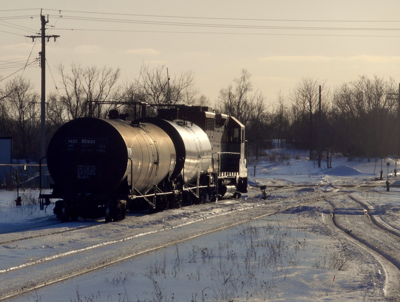 With great lighting, I thought I'd try a silhouette shot.  Here, the crew of train 582 has run out of hours, and therefore has tied down their train on the Fergus spur until the next morning.  Due to freezing temperatures, the snow has become a blanket of ice, sharp and slippery.  Seeing this photo serves as a reminder that the whie stuff will be here again soon.