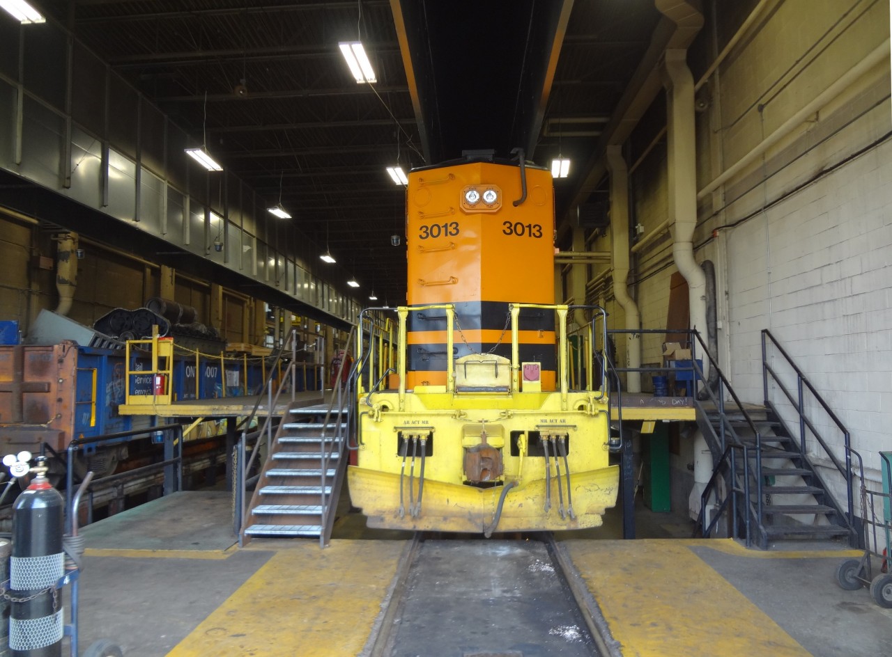 Huron Central 3013 gets a little fresh air and sunshine on its long hood through the open bay door of ONR's North Bay diesel shop. The car shop, diesel shop, and yard were all buzzing with activity on this beautiful early September afternoon.