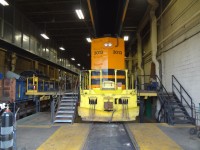 Huron Central 3013 gets a little fresh air and sunshine on its long hood through the open bay door of ONR's North Bay diesel shop. The car shop, diesel shop, and yard were all buzzing with activity on this beautiful early September afternoon.