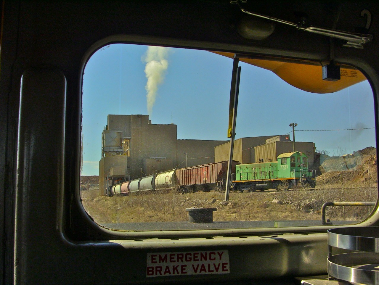 Agrium mine's remote switcher SW1200 7731 spots cars during the arrival of ONT 516. Photo taken from the cab of ONT 2202, uploaded with permission. Agrium mine along with the Agrium sub were shut down shortly after this photo was taken.