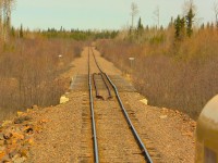 After lifting 30 or so car loads of phosphate from Agrium, 515 slows to a crawl for the less than favourable upcoming track conditions. Agrium mine as well as the Agrium subdivision closed shortly after this photo. Photo taken and uploaded with permission. 