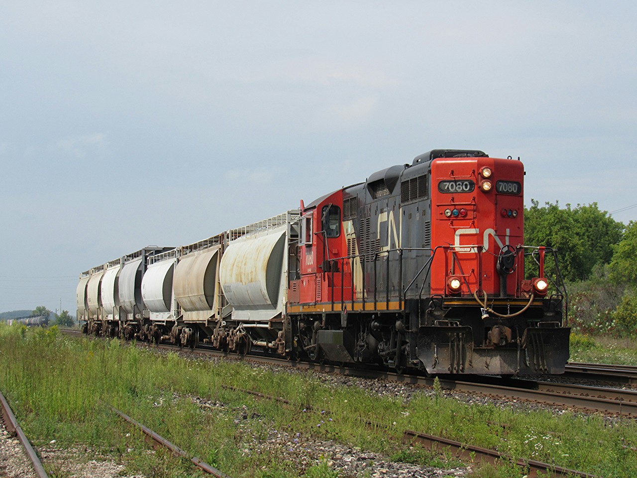 Brantford to Paris and return local L580, is taking a cut of cars back to the switch, then onto the north service track to connect them to another consist. CN GP9RM 7080 leads this train, along with a very friendly crew, who gave a toot of the horn and waved every time they passed back and forth.