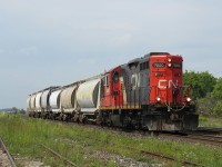 Brantford to Paris and return local L580, is taking a cut of cars back to the switch, then onto the north service track to connect them to another consist. CN GP9RM 7080 leads this train, along with a very friendly crew, who gave a toot of the horn and waved every time they passed back and forth. 