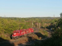 CP 2265 GP20C-ECO leads GP38-2 3003, and fellow GP20C-ECO 2290, down the Niagara Escarpment, heading into Kinnear Yard. CP 246 south, was right behind him, so 2265 must clear the main track, so 246 could squeeze into Kinnear. A pretty morning sky and fall colours made for a nice background. 