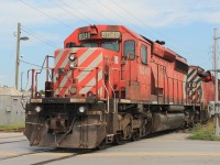 Multimarks the proper way. Two CP SD 40-2 6018 and 6048 follow CP 6257 with their multimarks next to each other. The locos have just returned light from the tunnel and are seen crossing Dougall Avenue on this very humid Saturday!