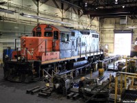 Canadian National GMD GP9u 7025 sits inside the LRC (Locomotive Repair Center) inside the largest railroad yard in whole of Canada, likely for display for CN's Family Day.