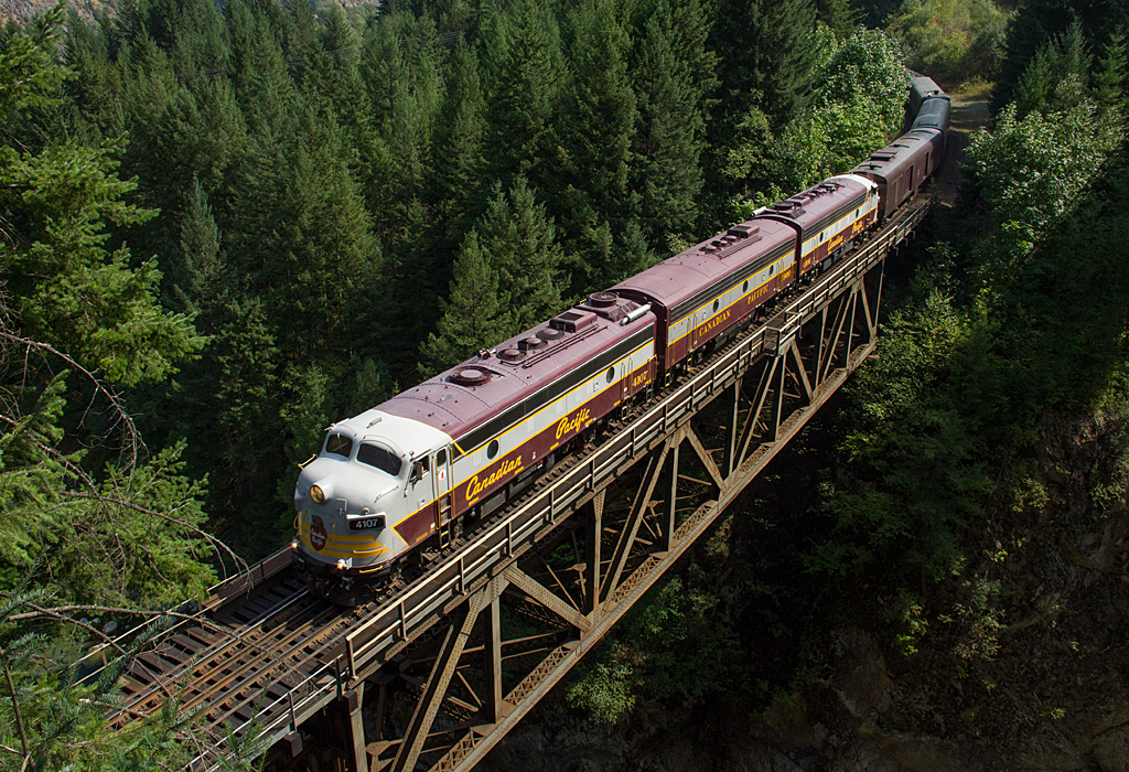 Into the Fraser Canyon, headed east, the Royal Canadian Pacific is seen crossing Spuzzum Creek Bridge. Much vegetation has overgrown in the Fraser Canyon, making once possible spots for shooting more difficult today.