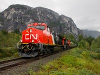 CNs business train recently did a tour of Western Canada from North Vancouver to Edmonton, which included the former BC Rail line. With the Stawamus Chief behind, the train is approaching Squamish with two of CNs newest ET44ACs at the helm of this six car train. 