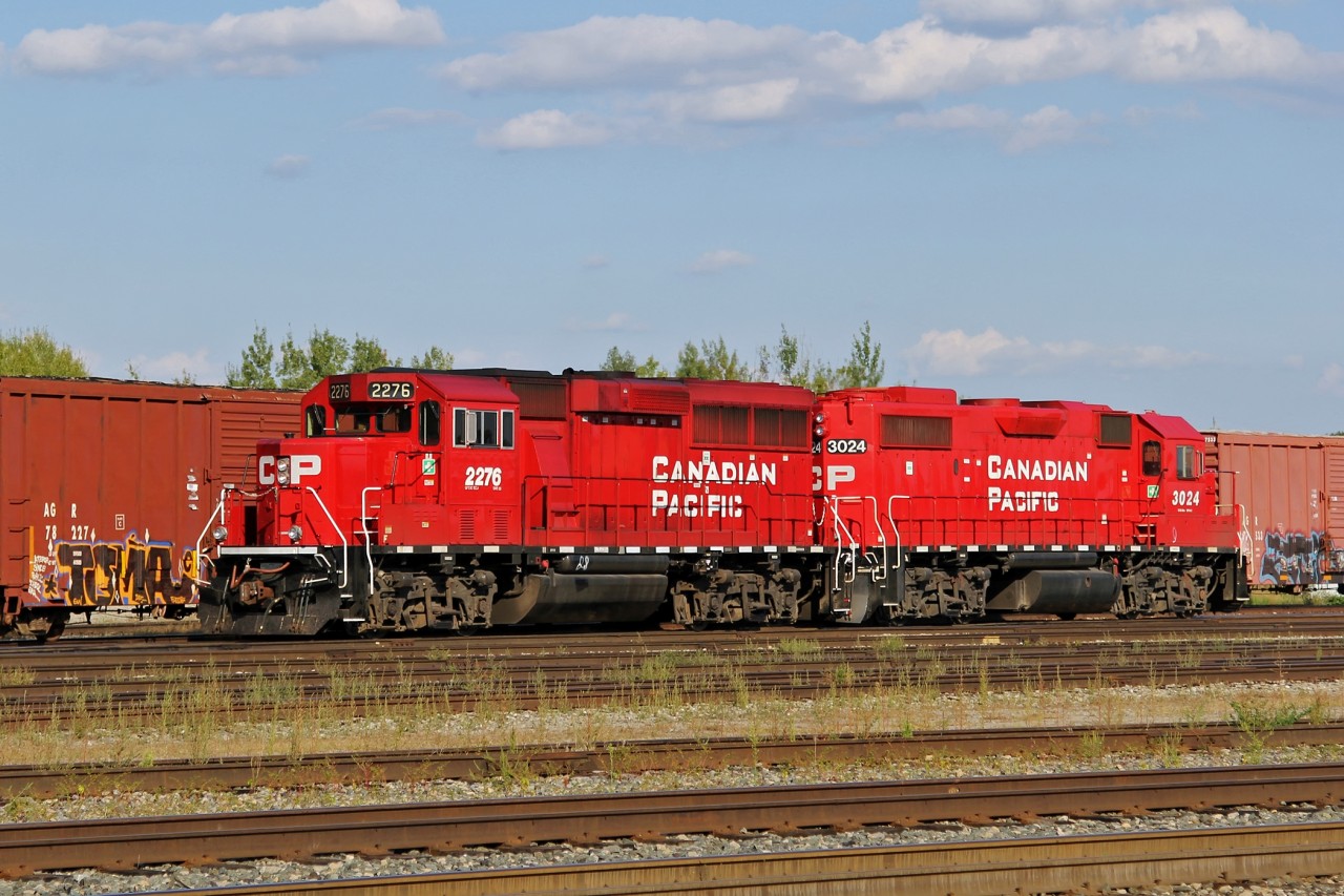 GP20C-ECO 2276 and GP38-2 3024 work at the west end of Smiths Falls yard.