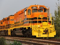 [Editors  note: This is the first photo of the newly repainted 3394 on its second tour of duty] It is a muggy morning this 1st of September 2015 as GEXR 432 prepares to depart Kitchener for CN's MacMillan Yard in Vaughan. Today was the first time I saw the second of the two GATX blue and white SD40-2s to be repainted in the G&W yellow and orange paint that seems to be taking over. It looks nice!