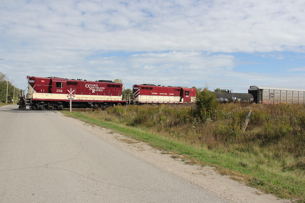 OSR backs up racks into Cami, here seen crossing over Thomas Rd. in the west end of Ingersoll.