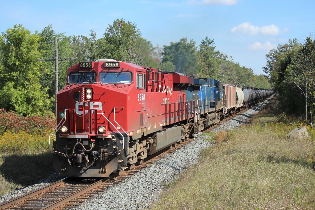 After a long absence from my old stomping ground because of a lack of traffic, I managed to catch CP 8958 leading CEFX 1051 past MM43 on the Galt sub, accelerating up the grade after getting clearance from the work crew working at the Puslinch siding at MM45 with its manifest of ethanol tankers.