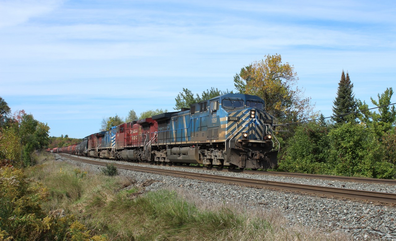 After coming up from Hamilton, CEFX 1059 leads CP 9831, CEFX 1024 and CP 8560 rounds the bend up to Tremaine Rd with a mixed manifest of freight.
